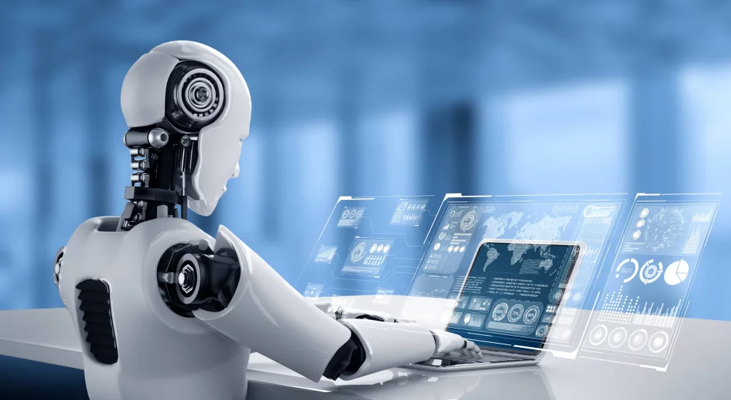 Inteligencia artificial. Imagen que describe a un robot manejando un ordenador.